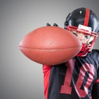 Let’s Talk About High School Sports!!! high school football player holding football