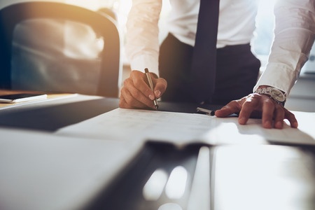 Man Signing a Contract