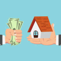 hand of businessman with money buying house isolated on blue background