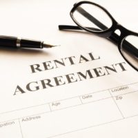 rental agreement form on desktop in business office showing real estate concept