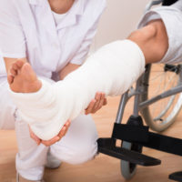 Guest Author For This One, DJ Gomer; Never Trust An Exam close-up of a female doctor holding disabled patient's leg