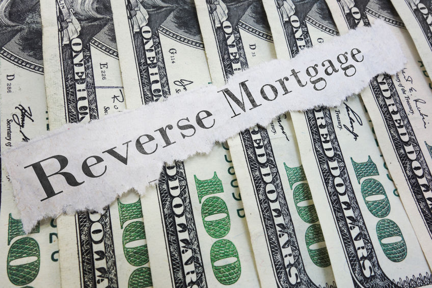 reverse mortgage paper message on assorted cash