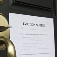 eviction notice letter posted on front door of house