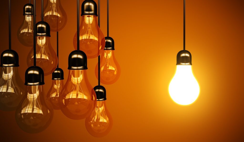 idea concept with light bulbs on a orange background