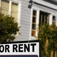 House  with "For Rent" sign in front