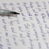 Handwritten letter with pen